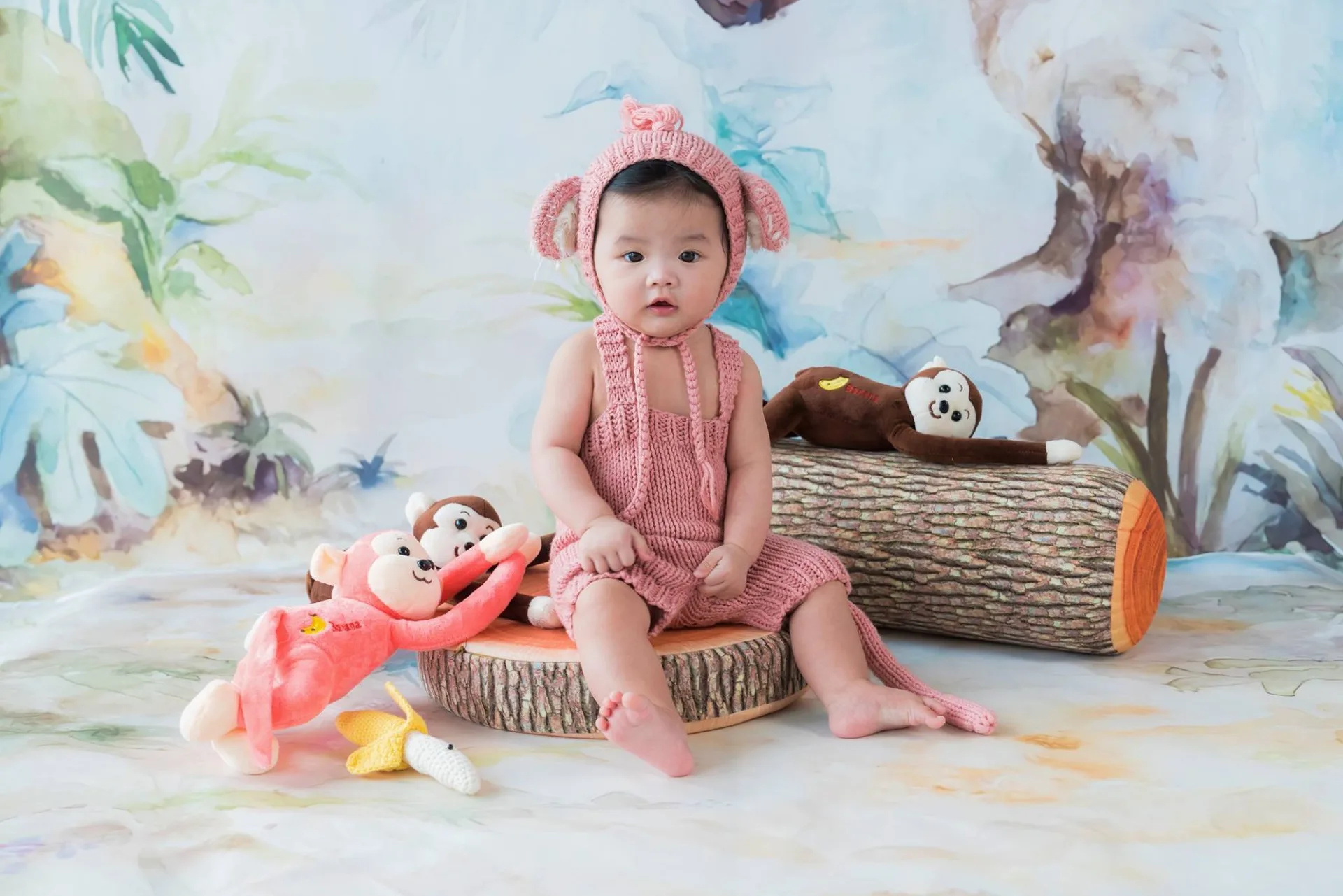 Baby studio portrait guided gently by the photographer